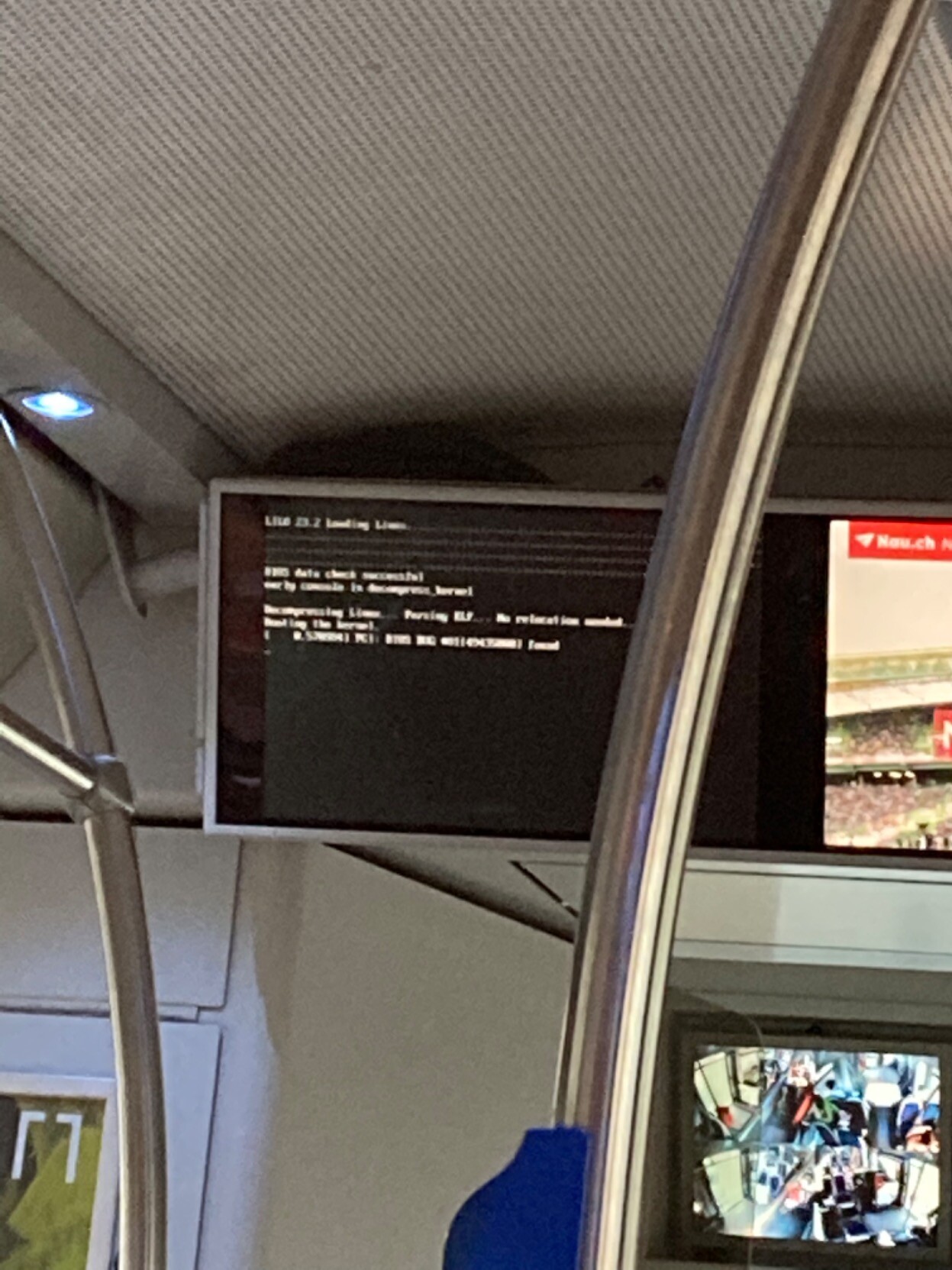 Blurry picture of a bus screen rebooting, showing LILO as the bootloader.